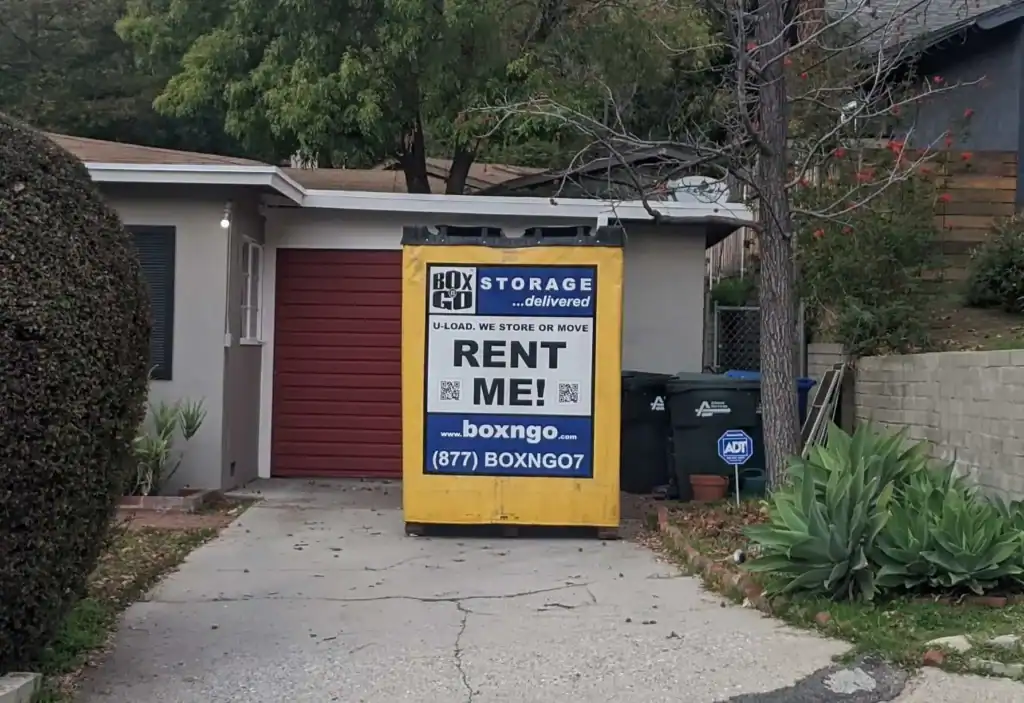 Yellow Box-n-Go portable storage unit placed in a residential driveway, promoting flexible and secure Self Storage Units in Burbank CA for home organization, moving, and renovation needs.