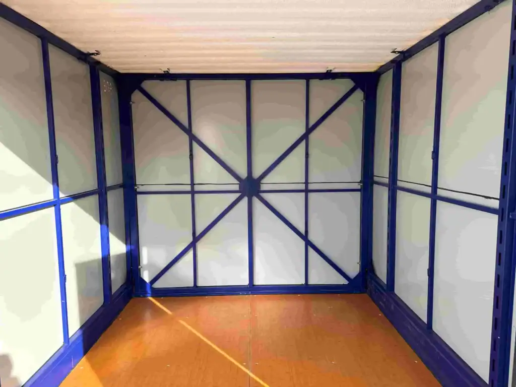 Interior view of a portable storage Montrose container featuring sturdy metal framing and clean wood flooring, showing spacious and secure on-site storage capacity.