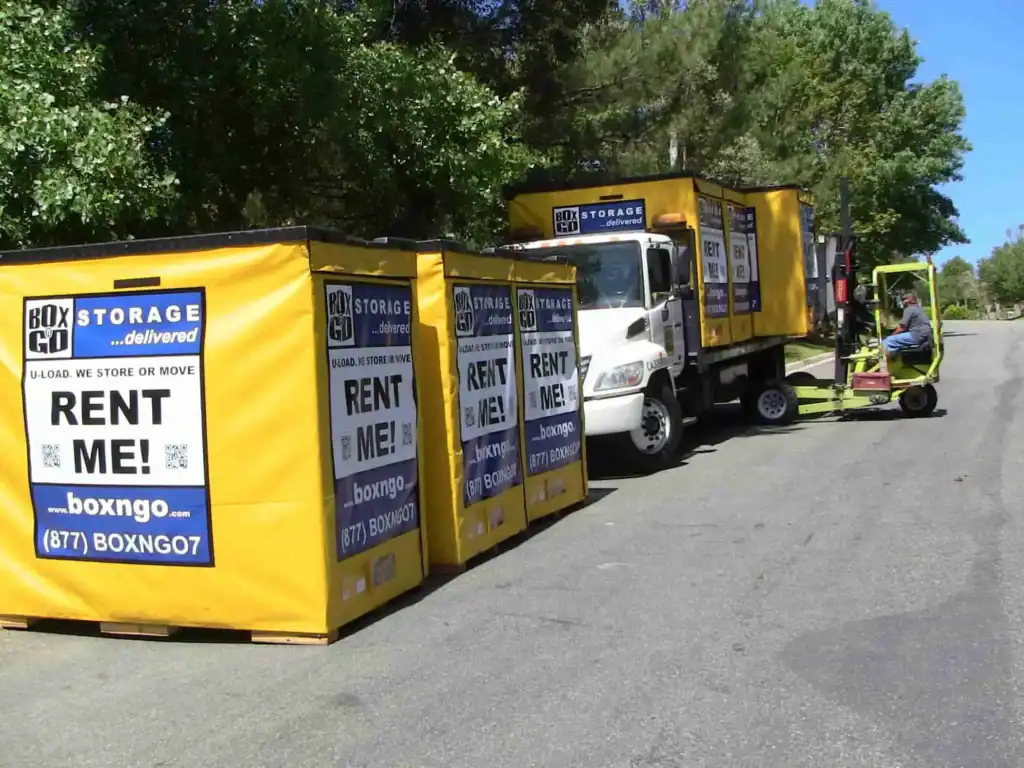 Montrose Mini Storage Portable storage Montrose units being delivered and arranged on a residential street with a forklift and truck from a mobile storage company.
