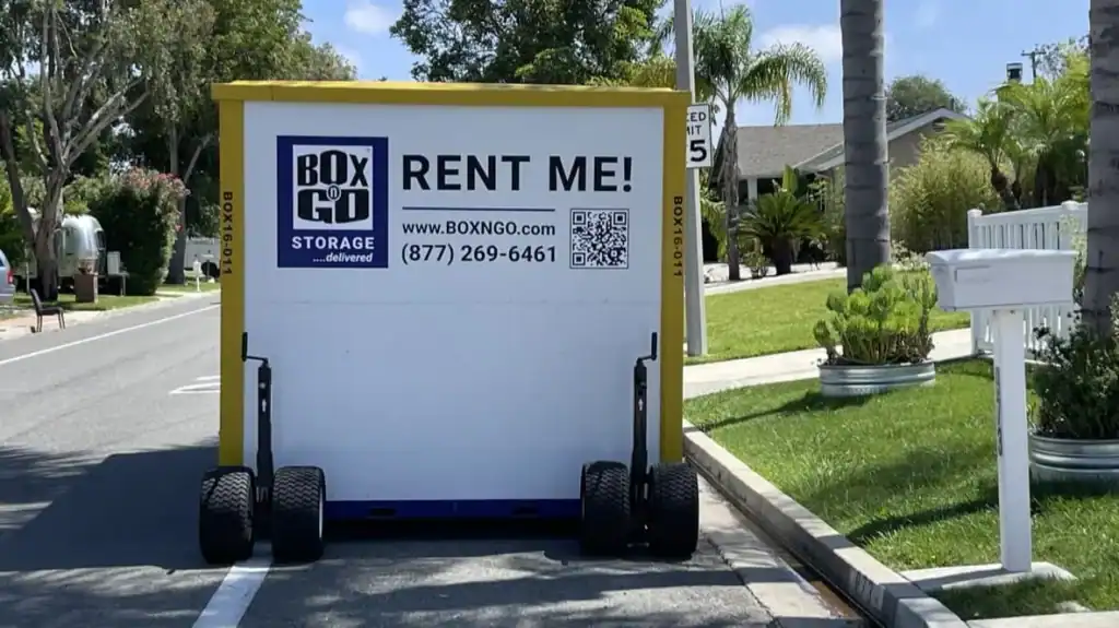 Yellow Box-n-Go container placed on a residential street, promoting portable storage Reseda services with convenient mobile storage rental options.