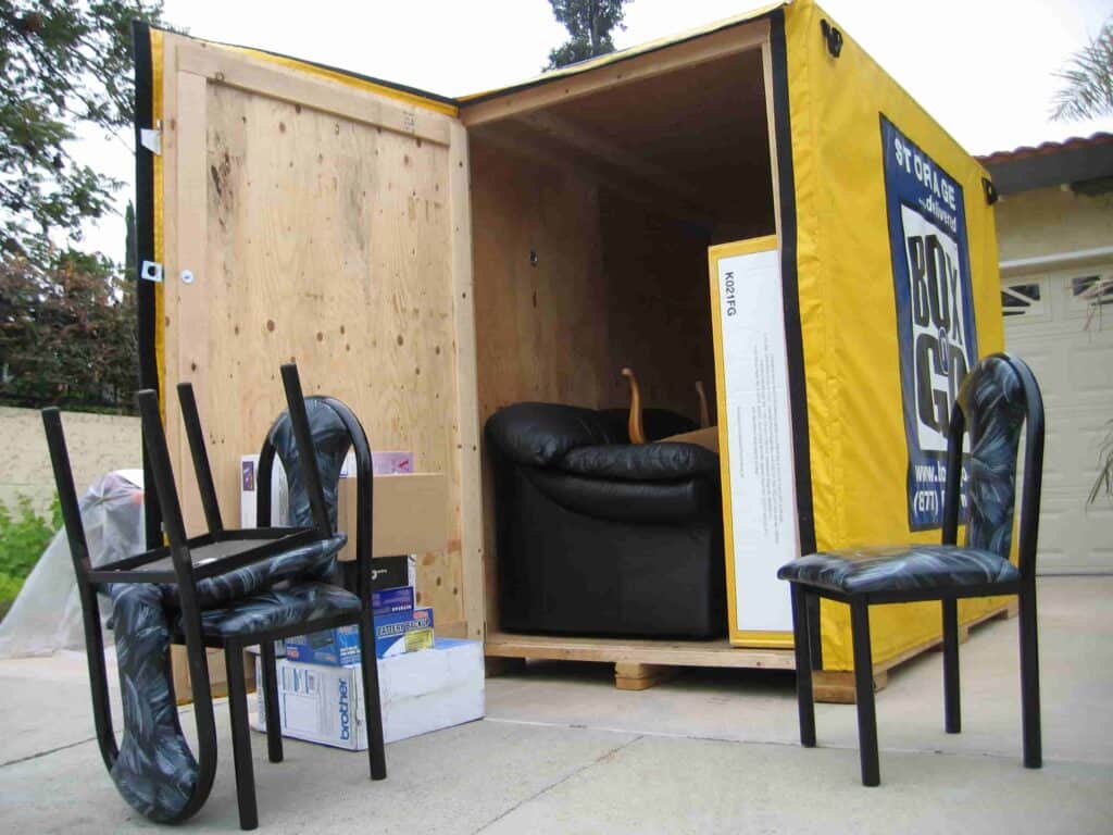 Open Box-n-Go portable storage unit being loaded with furniture for a self-storage-brentwood solution, showing convenient at-home packing and moving.