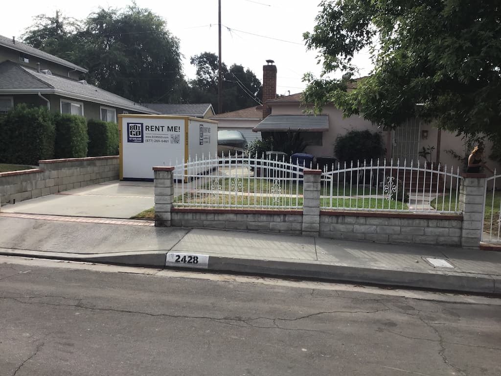 self storage brea ca showing a storage container portable storage container parked along the curb in a neighborhood setting