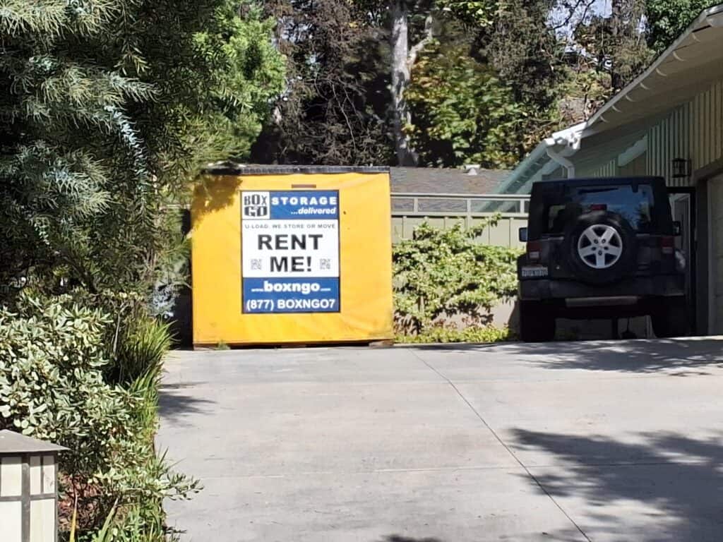 Mobile storage unit in Winnetka CA beside residential driveway
