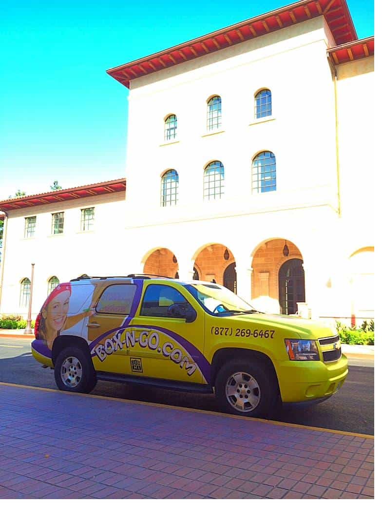  A claremont mckenna student storage unit parked in a parking lot with cones visible.