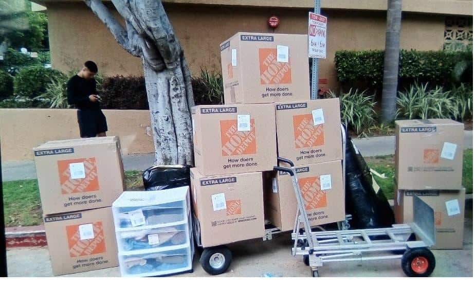 Student items including Home Depot boxes packed and labeled for College storage near Woodbury University.
