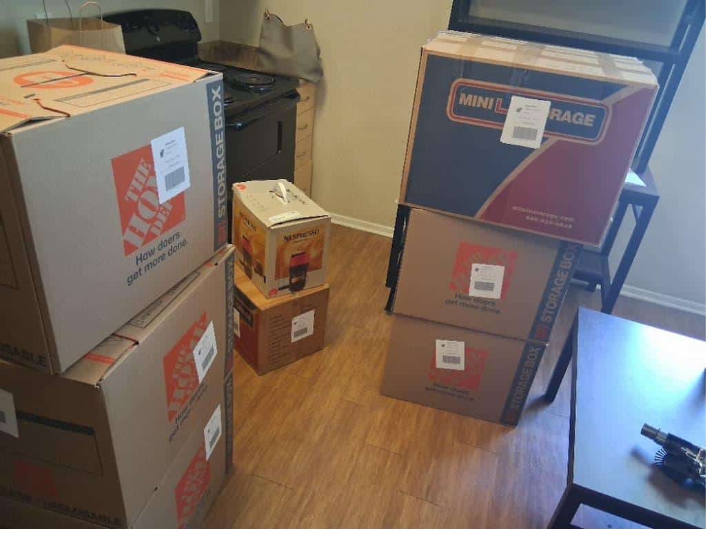 Student items including a plastic drawer unit packed and labeled for Scripps College student storage.