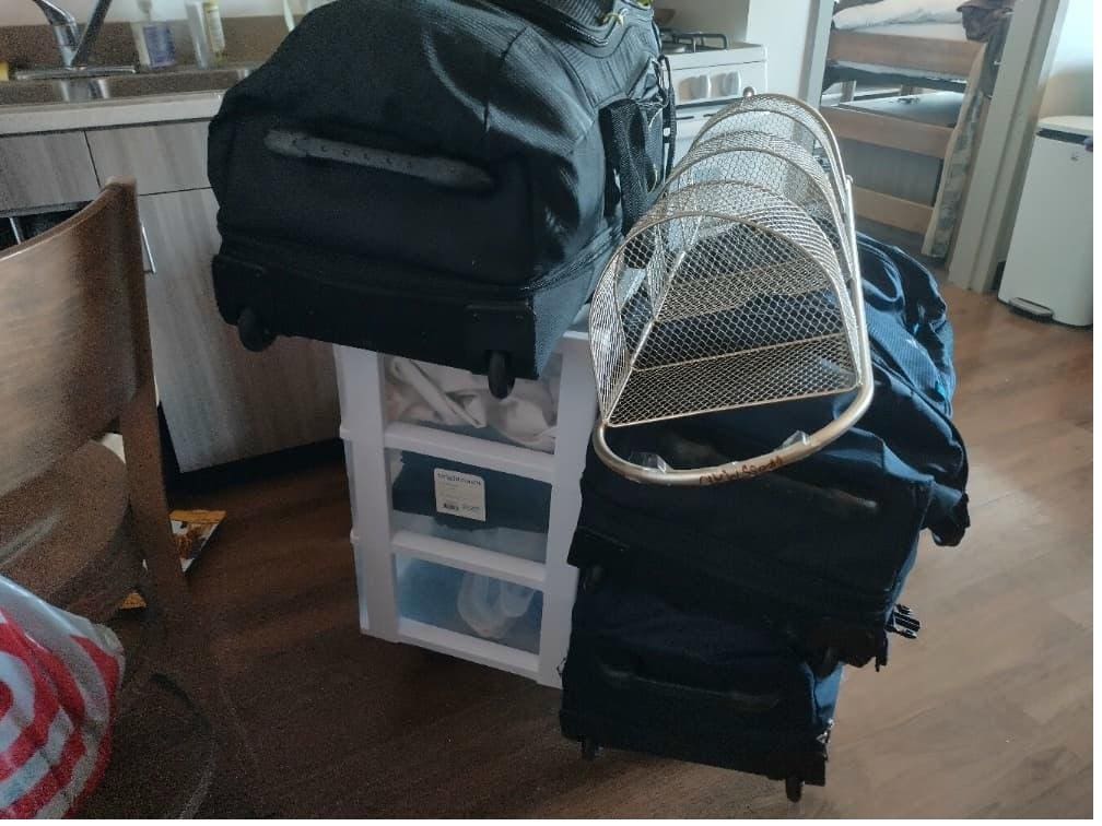 Student items including storage trunks packed and labeled for cal poly storage.