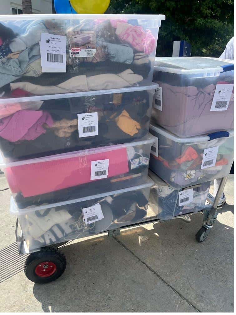 Student items including a wardrobe box packed and labeled for caltech student storage.Title: Caltech Student Storage Items