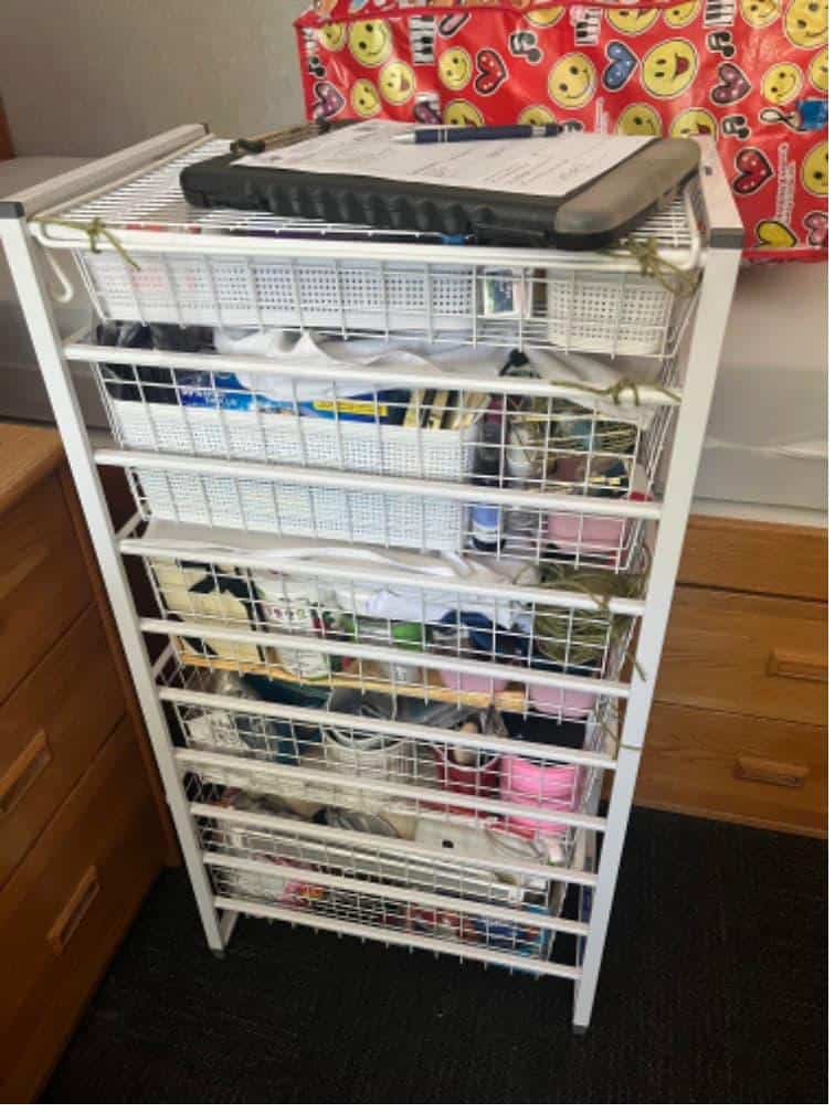 Student items including boxes and duffel bags packed and labeled for storage near 90045.