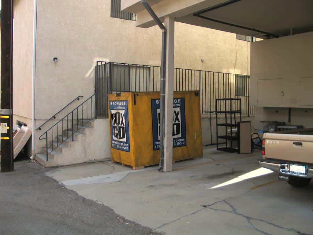 A storage near cal state fullerton unit parked in a covered area with stairs visible.