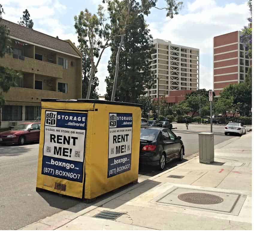 Portable storage units near Claremont Colleges from Box-n-Go beside the bollards.
