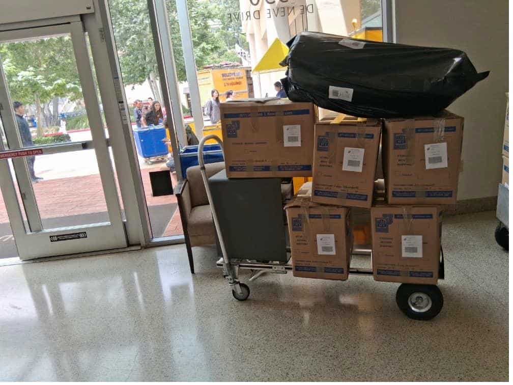 Student items including various moving boxes packed and labeled for Malibu student storage.