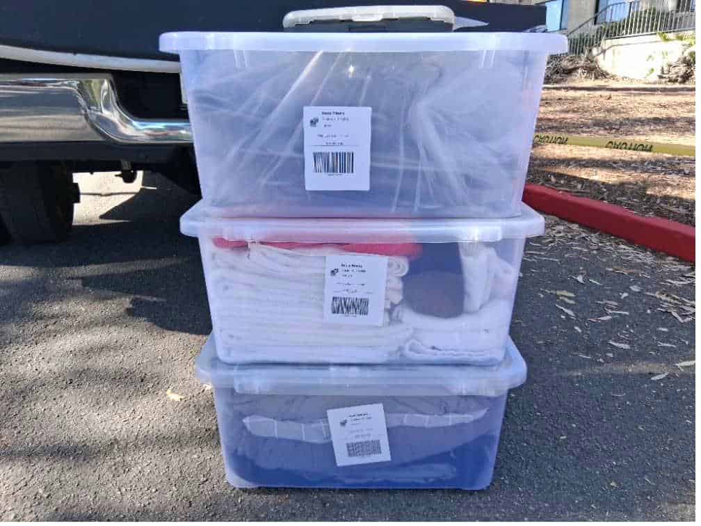 Student items including boxes in a pickup packed and labeled for short-term storage Pitzer College.