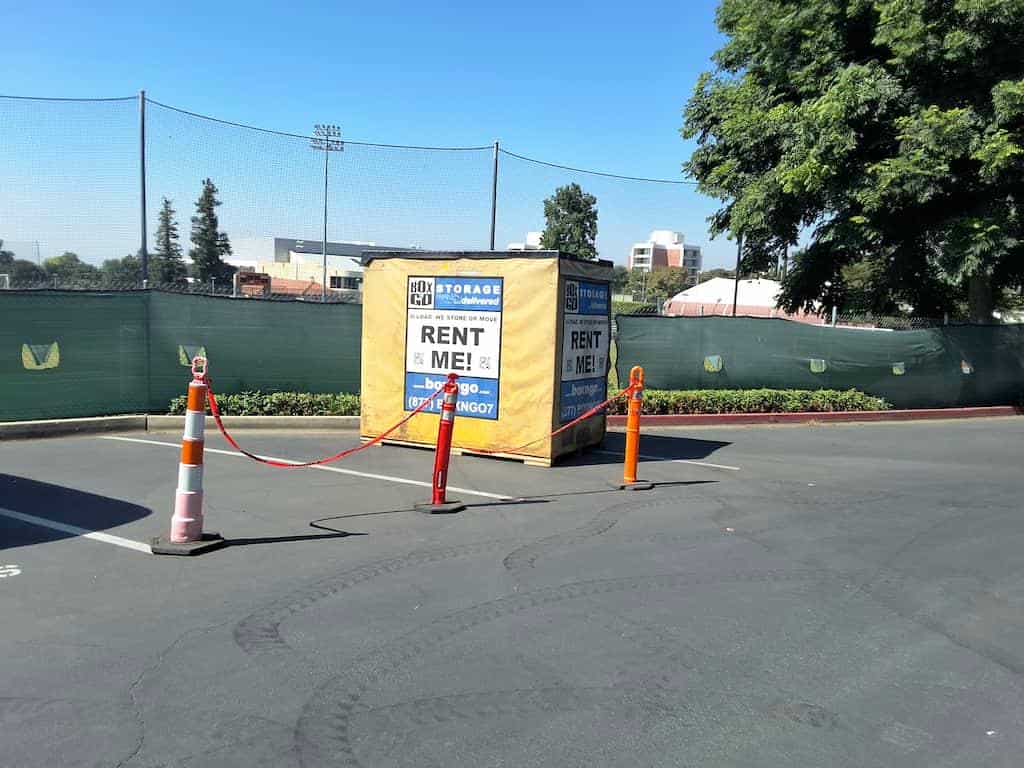 Portable storage near claremont mckenna college unit next to trees on a sunny day.