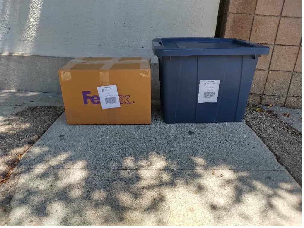 Student items including a FedEx box packed and labeled for student storage and shipping.