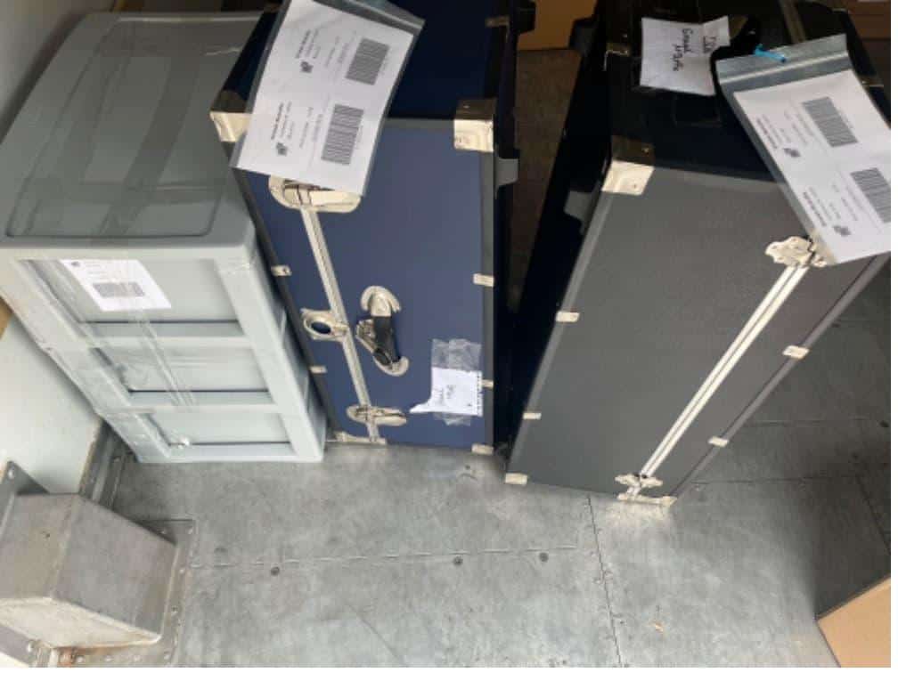 Student items including boxes on a flat cart packed and labeled for student storage Azusa.