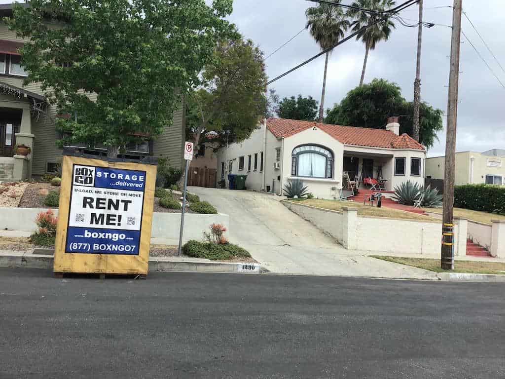 Box-n-Go storage near usc campus under blooming jacaranda trees.