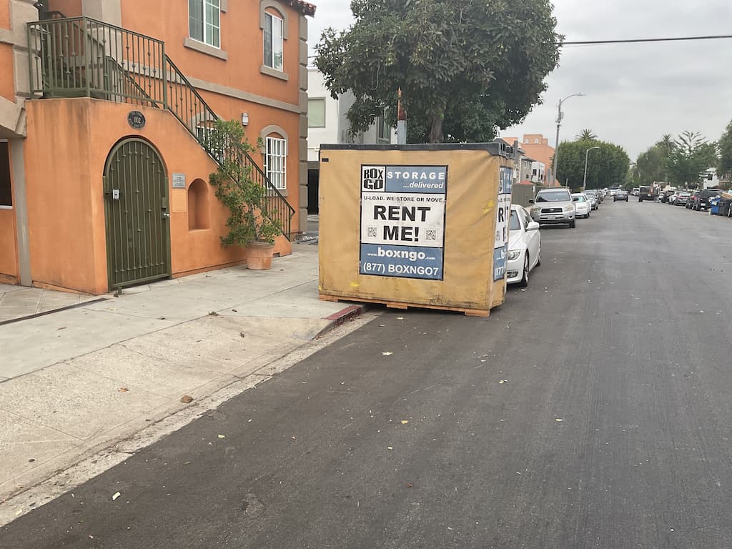 self storage lomita ground-level storage unit staged beside a home or apartment building