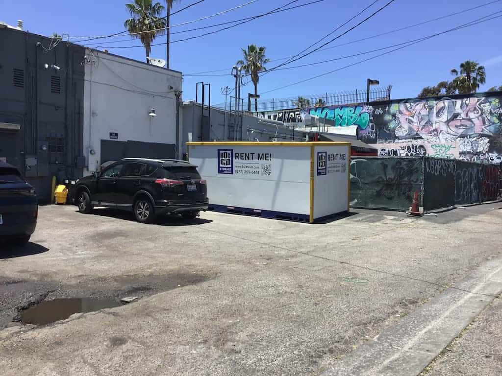 rent storage irvine with an on-site container ground-level storage unit staged beside a home or apartment building