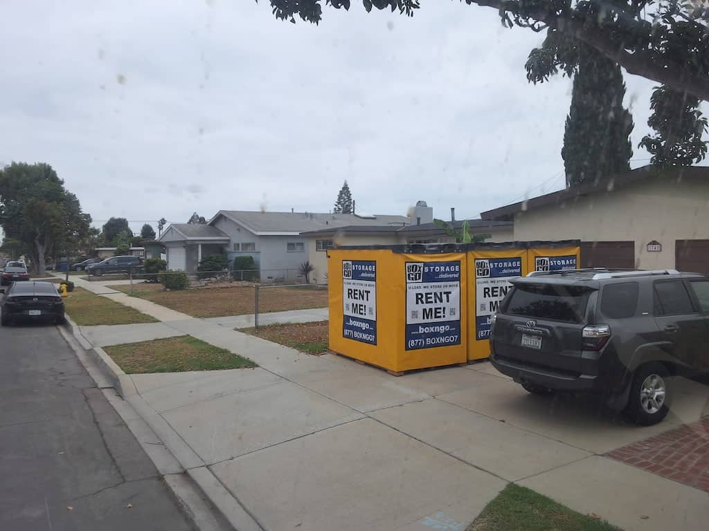 self storage midway city with an on-site container portable storage container parked along the curb in a neighborhood setting