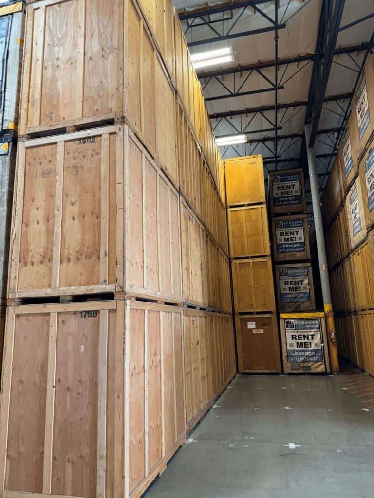 Interior of Box-n-Go's Commerce, California warehouse with portable storage containers stacked indoors