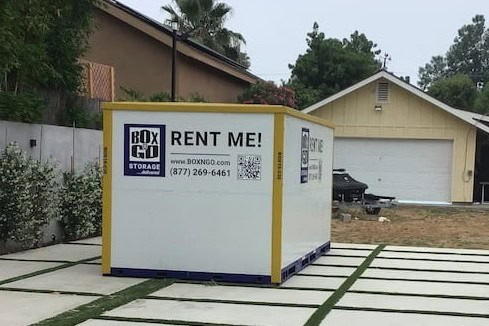Box-n-Go portable storage container placed on a residential driveway for Home Access