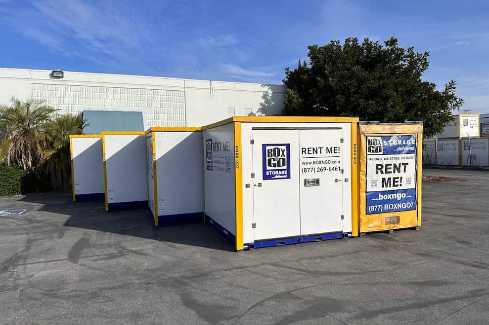 Lineup of Box-n-Go portable storage containers in different sizes at the Box-n-Go facility — Southern California