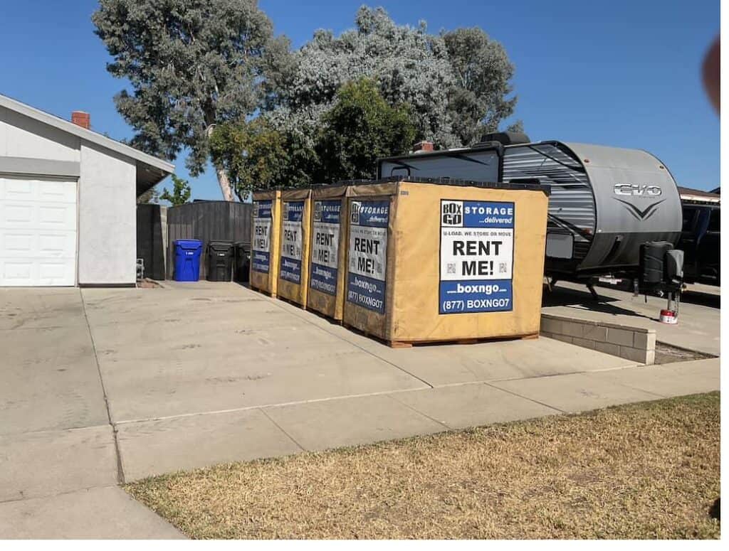 Four Box-n-Go Flex storage containers staged on a residential driveway in Southern California