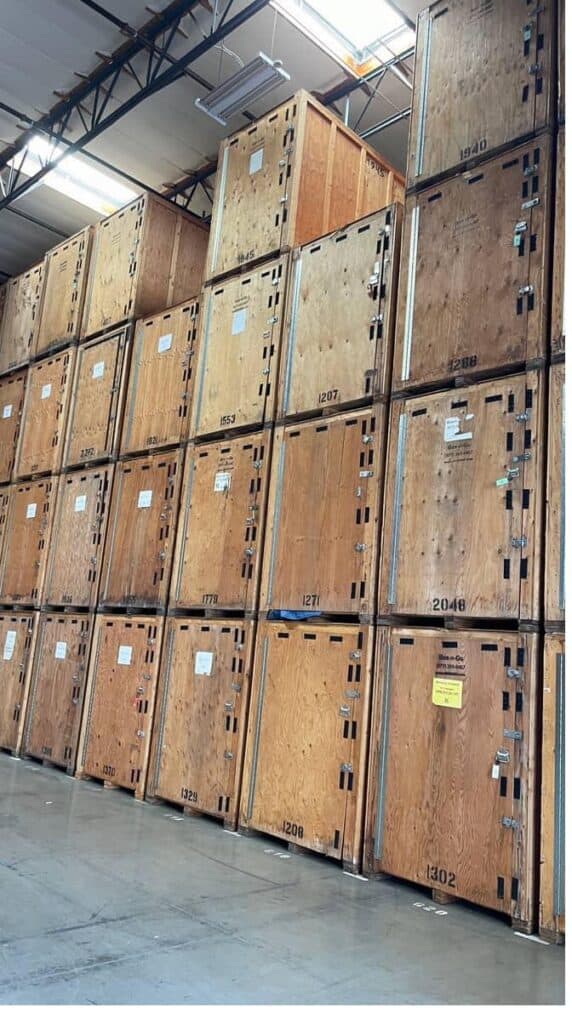 Stacked wood Flex containers inside the Box-n-Go warehouse