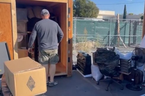 Customer accessing an open Box-n-Go portable storage container at the warehouse access area