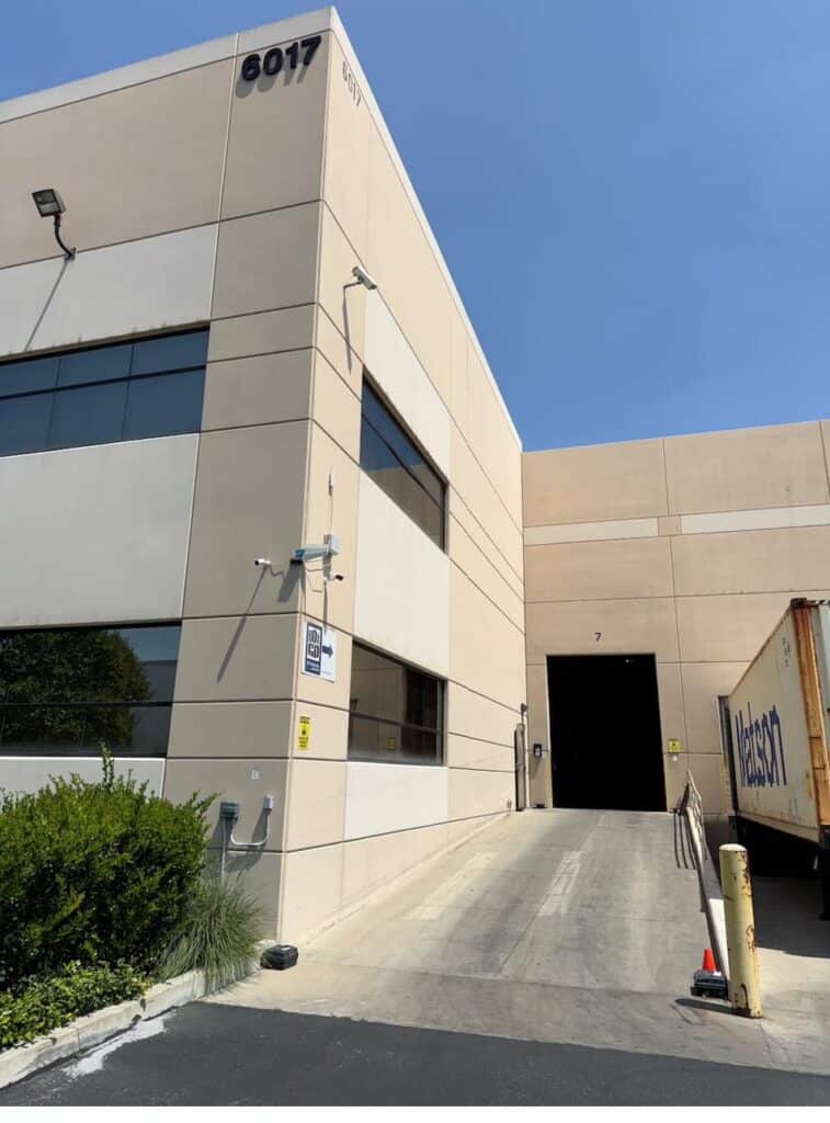 Box-n-Go warehouse exterior with security cameras visible above the loading dock entrance