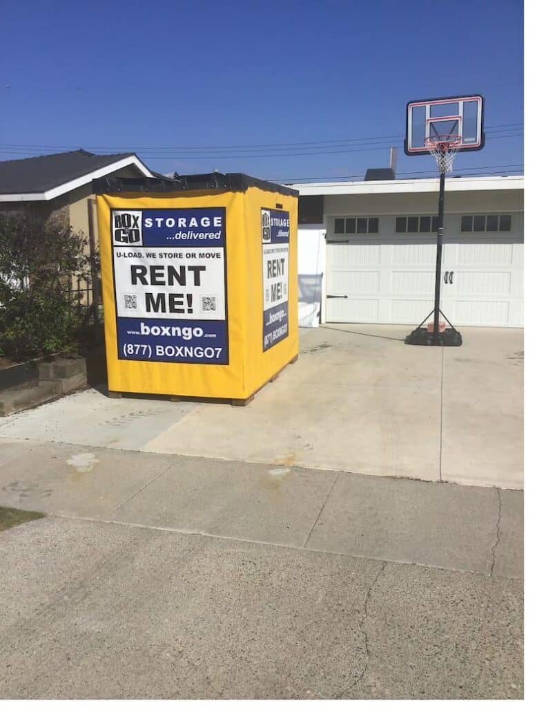Box-n-Go Flex portable storage container at a Southern California residential driveway covered by On-Site Storage Damage Waiver.