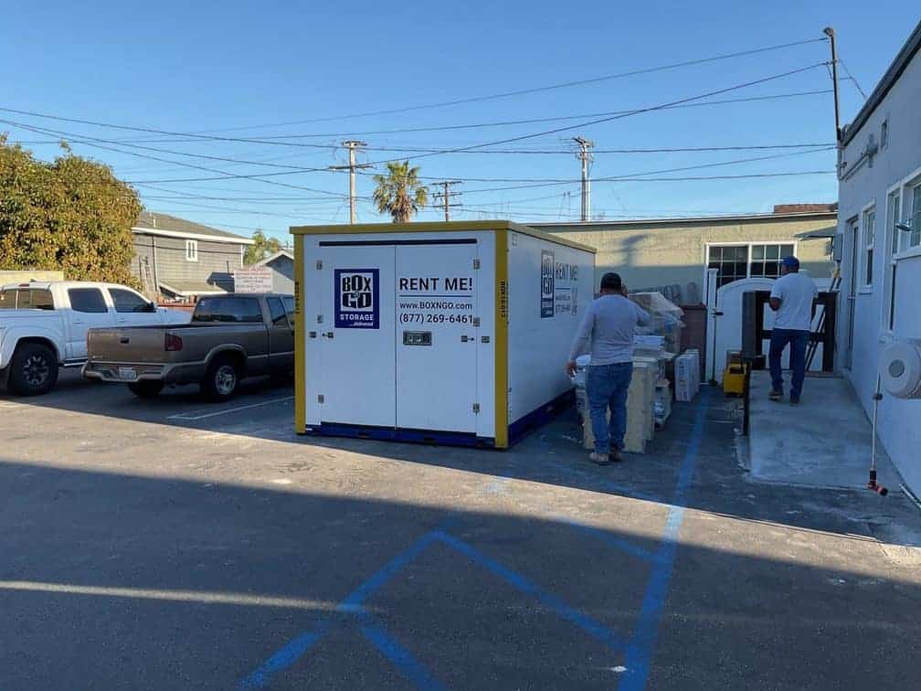 Crew loading a Box-n-Go container during emergency restoration services at a Southern California property